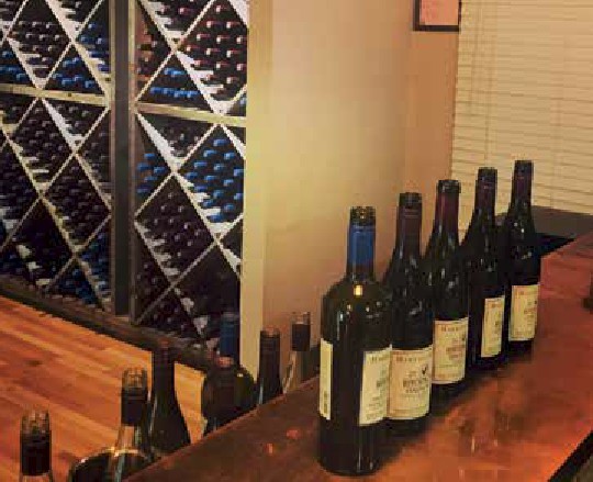 Hitching Post Wine Bottles on the Tasting Room Bar